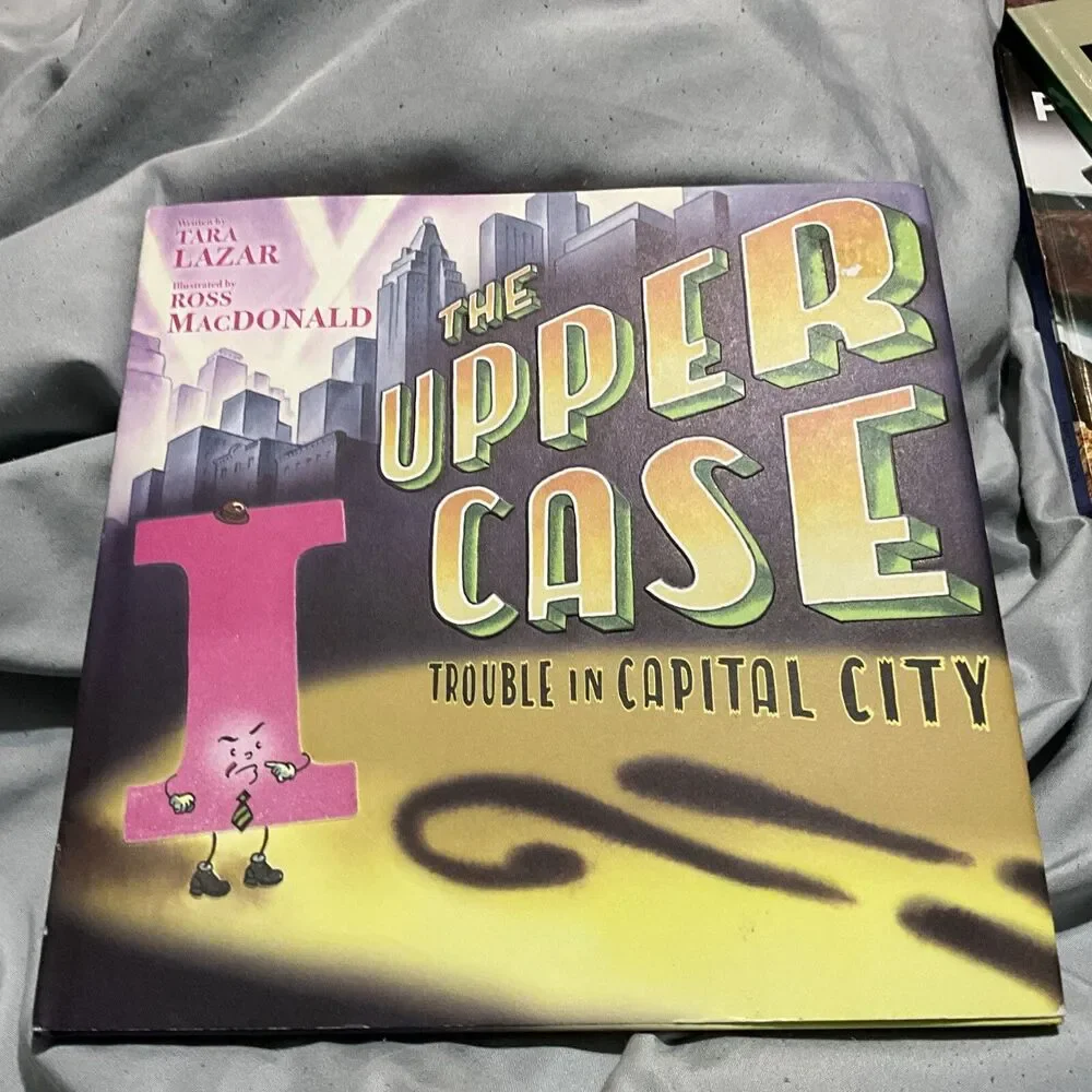 THE UPPER CASE TROUBLE IN CAPITAL CITY HARDCOVER W/ DUST COVER 1ST ED. 2019 NEW